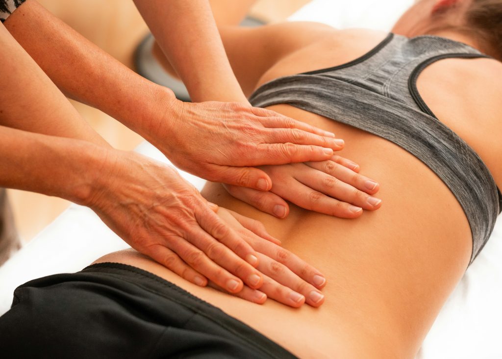 Hands-on chiropractic care on a patient's back — back pain relief without medication in Brentwood CA